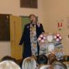 Julia Morton-Marr addressing students at the Cadarackque Public School in Ajax Ontario in 2000. During this dedication students prepared messages of peace for students at schools in Jordan. 