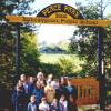 ISPG President Julia Morton-Marr joins students and staff of the Bobcaygeon Public School at the front entrance to their Peace Park in September 1998.